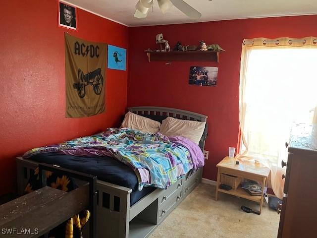 4767/4765 22nd St SW, Lehigh Acres, FL 33973 - carpeted bedroom featuring ceiling fan