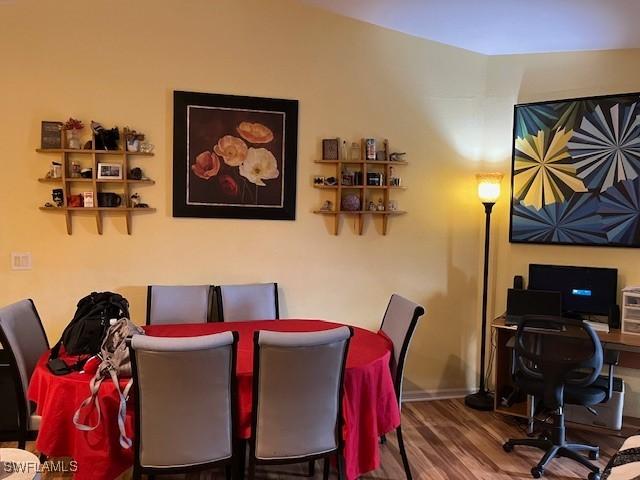 4767/4765 22nd St SW, Lehigh Acres, FL 33973 - dining room featuring wood finished floors, an office area, and baseboards
