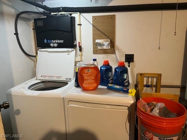 4767/4765 22nd St SW, Lehigh Acres, FL 33973 - washroom featuring separate washer and dryer