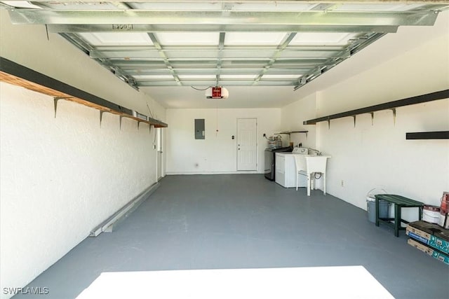 3127 Boca Ciega Dr Unit B6, Naples, FL 34112 - garage featuring washer and dryer, a garage door opener, and electric panel