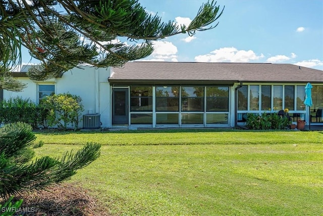 3127 Boca Ciega Dr Unit B6, Naples, FL 34112 - rear view of house featuring a yard, central AC, and stucco siding