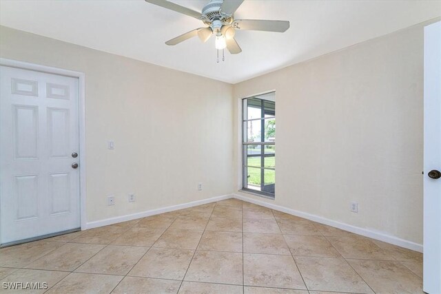 3127 Boca Ciega Dr Unit B6, Naples, FL 34112 - unfurnished room with light tile patterned floors, baseboards, and a ceiling fan