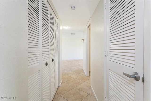3127 Boca Ciega Dr Unit B6, Naples, FL 34112 - corridor with light tile patterned flooring and baseboards