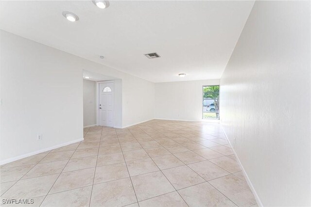 3127 Boca Ciega Dr Unit B6, Naples, FL 34112 - unfurnished room with baseboards and light tile patterned floors
