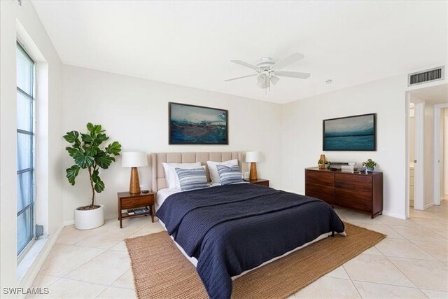 3127 Boca Ciega Dr Unit B6, Naples, FL 34112 - bedroom featuring light tile patterned flooring, ceiling fan, and baseboards