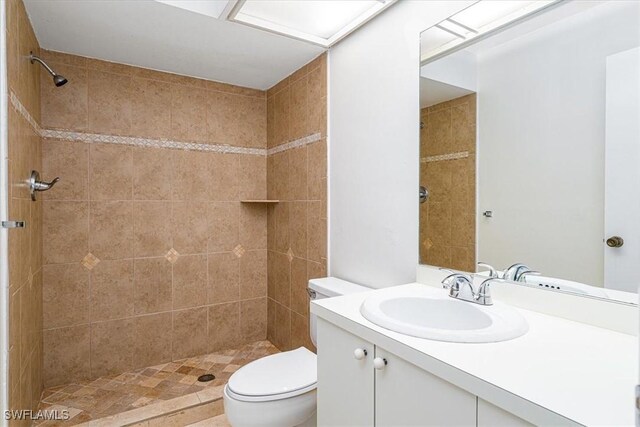 3127 Boca Ciega Dr Unit B6, Naples, FL 34112 - bathroom featuring vanity, toilet, and a tile shower