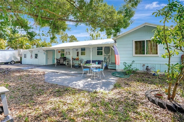 2153 Twin Brooks Rd, North Fort Myers, FL 33917 - rear view of property with a patio and entry steps