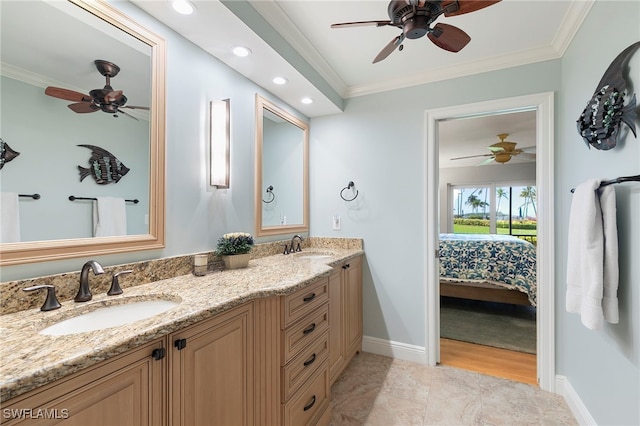 1080 S Collier Blvd Unit 103, Marco Island, FL 34145 - full bath with ensuite bath, a ceiling fan, double vanity, crown molding, and baseboards
