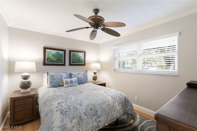 1080 S Collier Blvd Unit 103, Marco Island, FL 34145 - bedroom with wood finished floors, baseboards, crown molding, and a ceiling fan