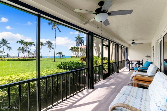 1080 S Collier Blvd Unit 103, Marco Island, FL 34145 - sunroom / solarium featuring a ceiling fan, a water view, and outdoor dining space