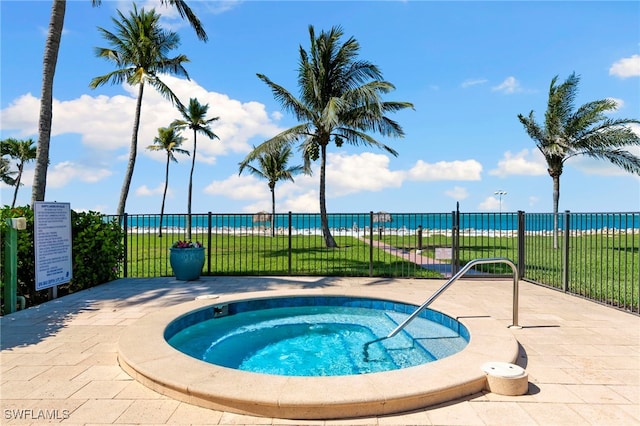 1080 S Collier Blvd Unit 103, Marco Island, FL 34145 - view of pool featuring a hot tub and a water view