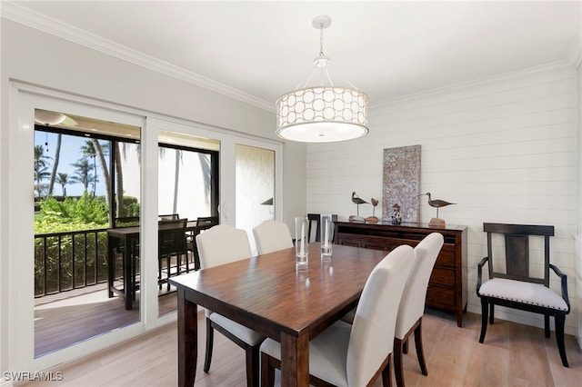 1080 S Collier Blvd Unit 103, Marco Island, FL 34145 - dining area featuring light wood-style flooring and ornamental molding