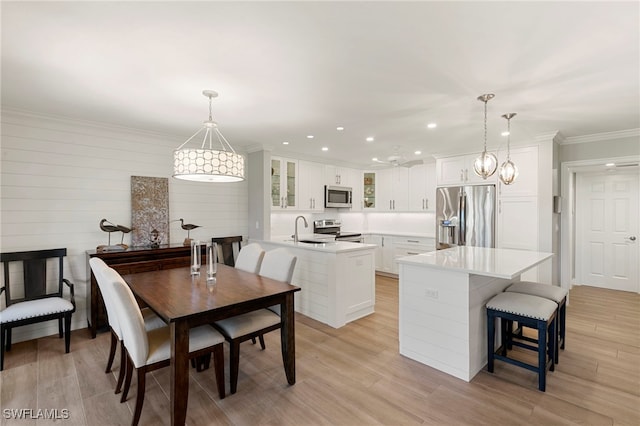 1080 S Collier Blvd Unit 103, Marco Island, FL 34145 - dining room with light wood-type flooring, crown molding, and recessed lighting