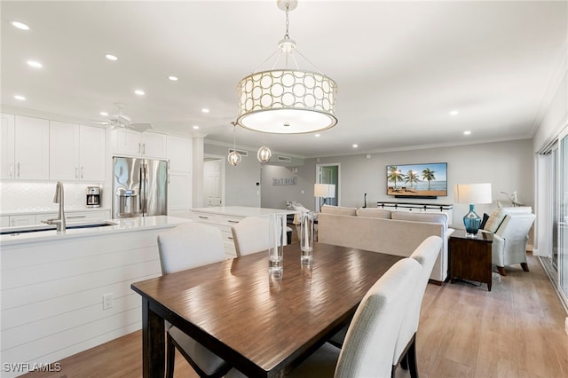 1080 S Collier Blvd Unit 103, Marco Island, FL 34145 - dining room featuring recessed lighting, light wood-style flooring, crown molding, and a ceiling fan