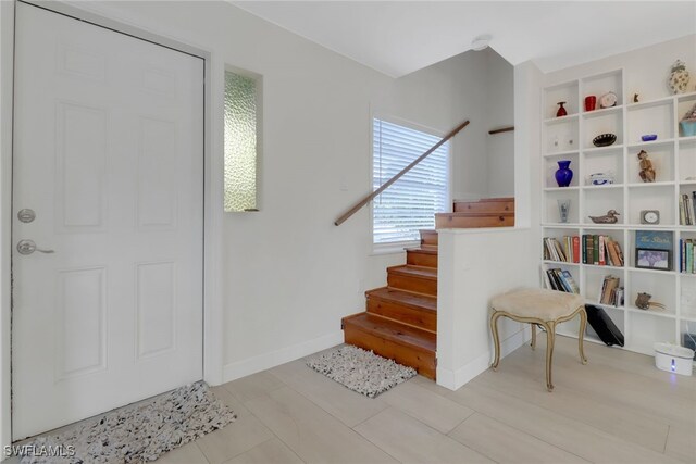 2662 Mangrove St, Naples, FL 34112 - foyer entrance featuring stairway and baseboards