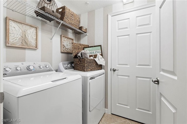 14826 Birchwood Ct Unit 6711, Punta Gorda, FL 33955 - laundry area featuring washing machine and clothes dryer, light tile patterned floors, and wallpapered walls