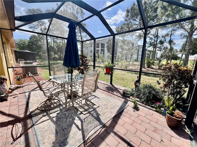 9317 Aegean Cir, Lehigh Acres, FL 33936 - view of patio featuring a lanai and outdoor dining space