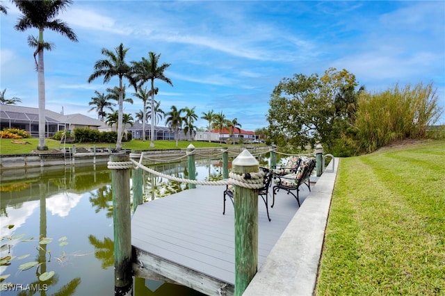 516 SE 14th Ter, Cape Coral, FL 33990 - dock featuring a water view and a lawn