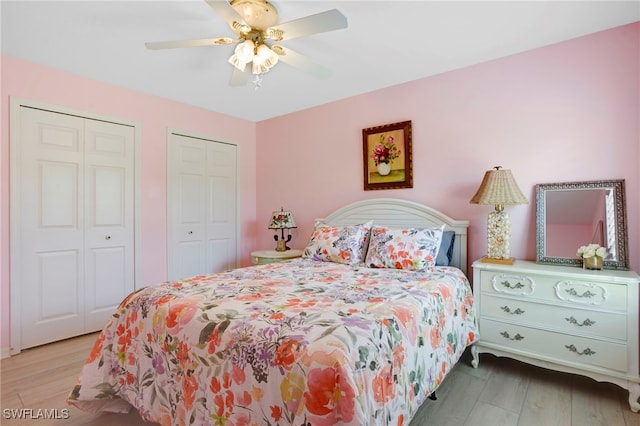 516 SE 14th Ter, Cape Coral, FL 33990 - bedroom with two closets, wood finished floors, and a ceiling fan