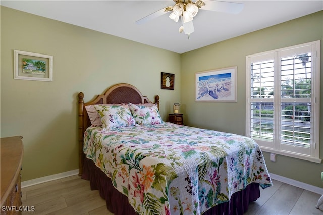 516 SE 14th Ter, Cape Coral, FL 33990 - bedroom featuring multiple windows, light wood-style flooring, and baseboards