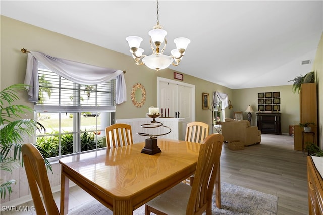 516 SE 14th Ter, Cape Coral, FL 33990 - dining area with a chandelier, light wood-type flooring, and lofted ceiling