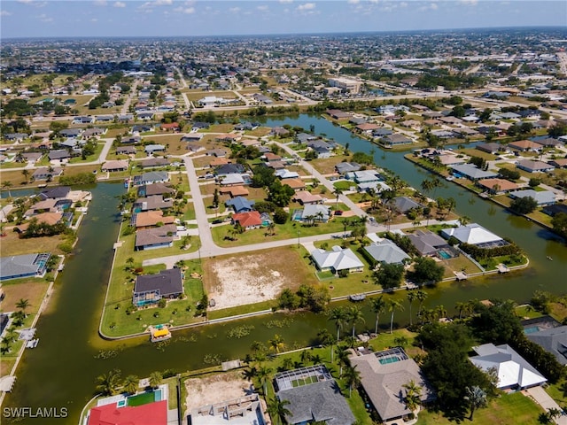 516 SE 14th Ter, Cape Coral, FL 33990 - aerial view of property and surrounding area with nearby suburban area and a nearby body of water