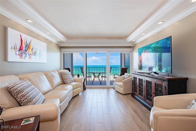 3443 Gulf Shore Blvd N Unit 409, Naples, FL 34103 - living area featuring light wood finished floors, ornamental molding, a raised ceiling, and recessed lighting