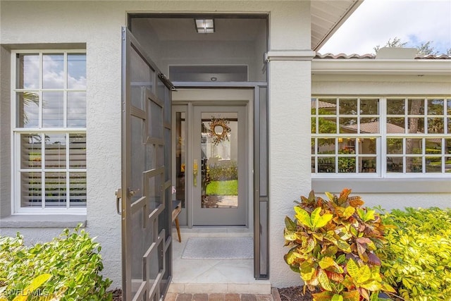 13461 Bridgeford Ave, Bonita Springs, FL 34135 - property entrance with stucco siding