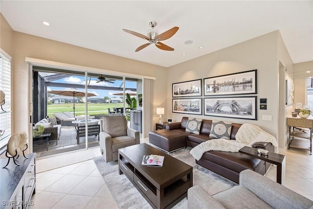 13461 Bridgeford Ave, Bonita Springs, FL 34135 - living room featuring ceiling fan and light tile patterned floors