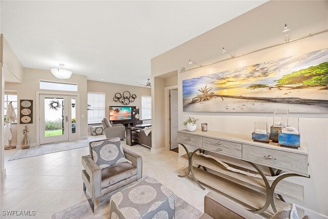 13461 Bridgeford Ave, Bonita Springs, FL 34135 - living room featuring light tile patterned flooring and baseboards