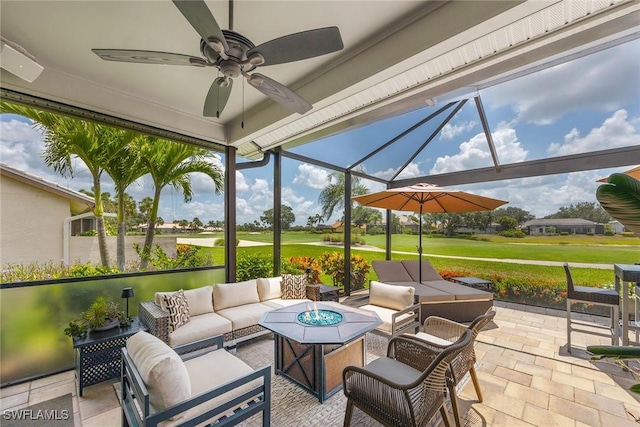 13461 Bridgeford Ave, Bonita Springs, FL 34135 - view of patio / terrace with view of golf course, an outdoor living space with a fire pit, ceiling fan, and a lanai
