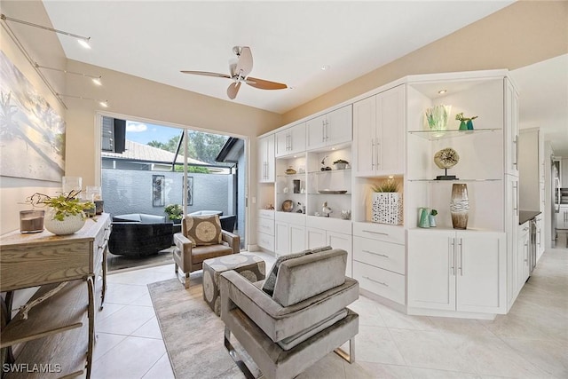 13461 Bridgeford Ave, Bonita Springs, FL 34135 - living area with ceiling fan and light tile patterned floors
