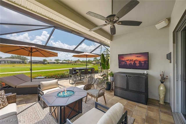 13461 Bridgeford Ave, Bonita Springs, FL 34135 - view of patio / terrace with an outdoor living space, ceiling fan, outdoor dining area, and glass enclosure