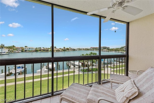 591 Seaview Ct Unit A306, Marco Island, FL 34145 - sunroom with a water view, a ceiling fan, and plenty of natural light
