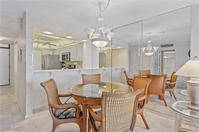 591 Seaview Ct Unit A306, Marco Island, FL 34145 - dining area featuring a ceiling fan