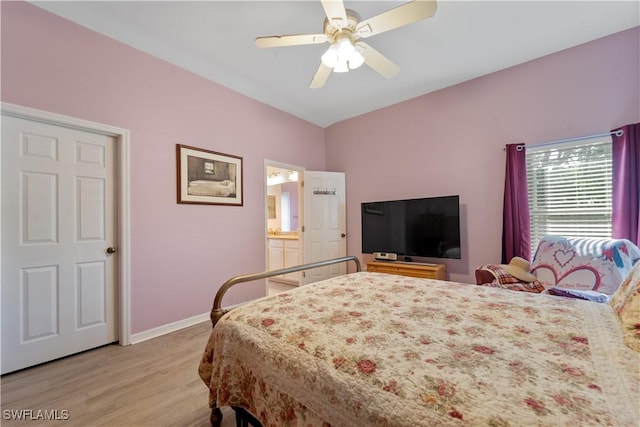 15721 Beachcomber Ave, Fort Myers, FL 33908 - bedroom with light wood-type flooring, baseboards, a ceiling fan, and connected bathroom