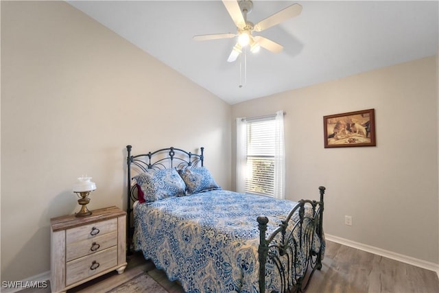 15721 Beachcomber Ave, Fort Myers, FL 33908 - bedroom featuring wood finished floors, baseboards, vaulted ceiling, and a ceiling fan