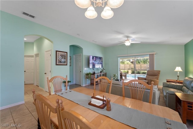 15721 Beachcomber Ave, Fort Myers, FL 33908 - dining room with arched walkways, ceiling fan, tile patterned floors, a chandelier, and baseboards