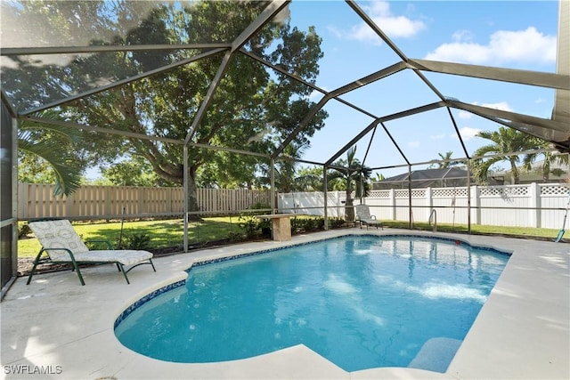 15721 Beachcomber Ave, Fort Myers, FL 33908 - view of swimming pool featuring a fenced backyard, a patio area, and a lanai