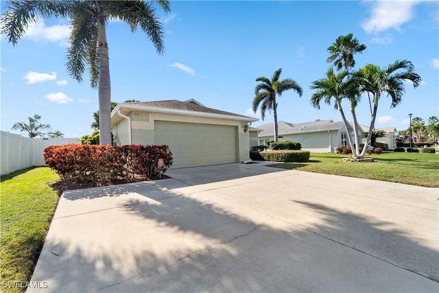 15721 Beachcomber Ave, Fort Myers, FL 33908 - view of front of property featuring stucco siding, an attached garage, and driveway