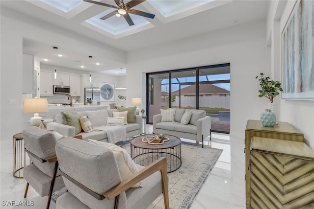 2204 SW 3rd Ter, Cape Coral, FL 33991 - living area with light marble finish flooring, a skylight, a ceiling fan, recessed lighting, and coffered ceiling