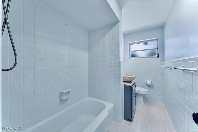 4101 Rainbow Dr, Fort Myers, FL 33916 - bathroom with toilet, tile walls, shower / tub combination, and vanity