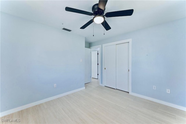 4101 Rainbow Dr, Fort Myers, FL 33916 - unfurnished bedroom with a closet, baseboards, wood finished floors, and ceiling fan