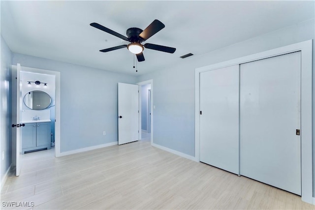 4101 Rainbow Dr, Fort Myers, FL 33916 - unfurnished bedroom with a closet, baseboards, and a sink
