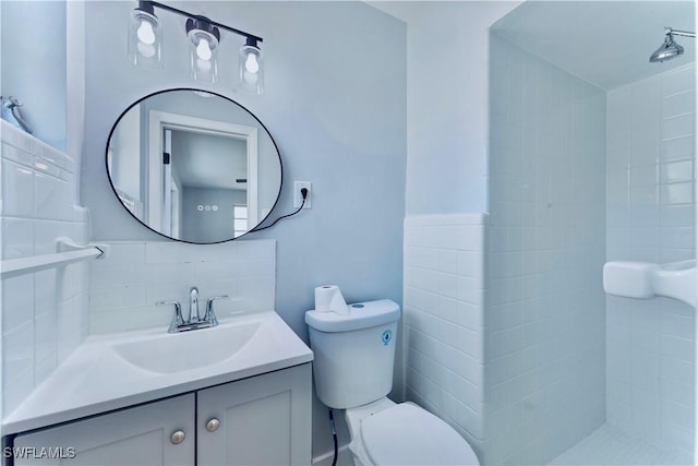 4101 Rainbow Dr, Fort Myers, FL 33916 - full bath featuring toilet, vanity, a tile shower, and backsplash