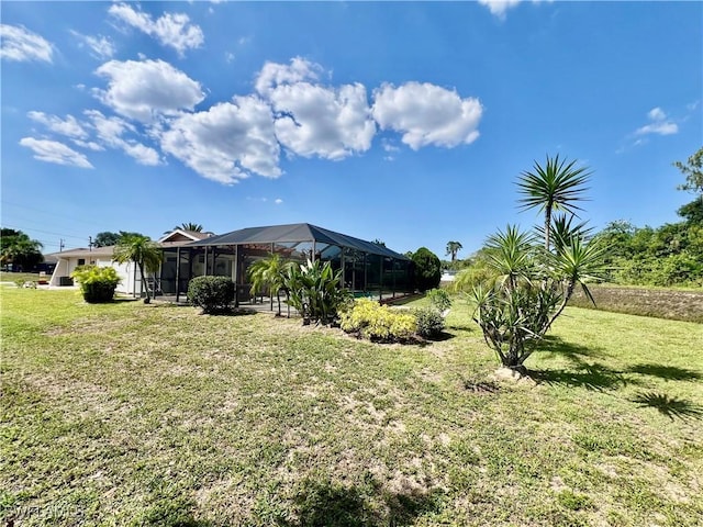 40 Ortona St, Lehigh Acres, FL 33936 - view of green lawn featuring a lanai