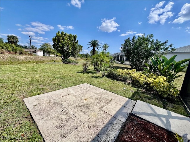 40 Ortona St, Lehigh Acres, FL 33936 - view of green lawn featuring a patio