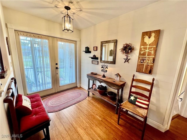 40 Ortona St, Lehigh Acres, FL 33936 - entryway featuring french doors, wood finished floors, and baseboards