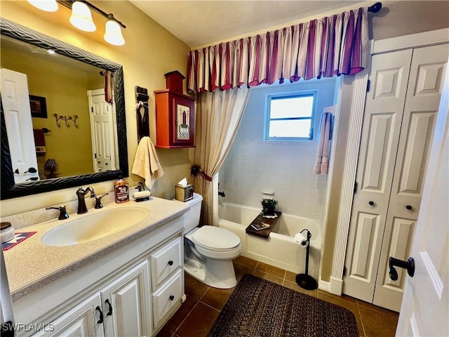 40 Ortona St, Lehigh Acres, FL 33936 - bathroom featuring tile patterned flooring, vanity, toilet, a closet, and shower / tub combo with curtain