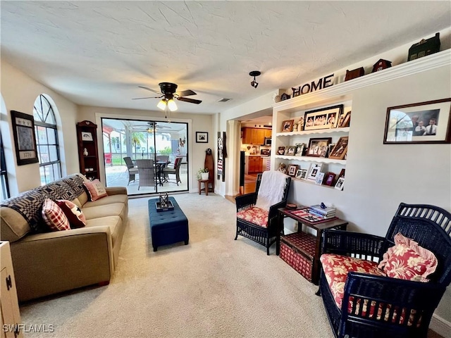 40 Ortona St, Lehigh Acres, FL 33936 - carpeted living area featuring ceiling fan